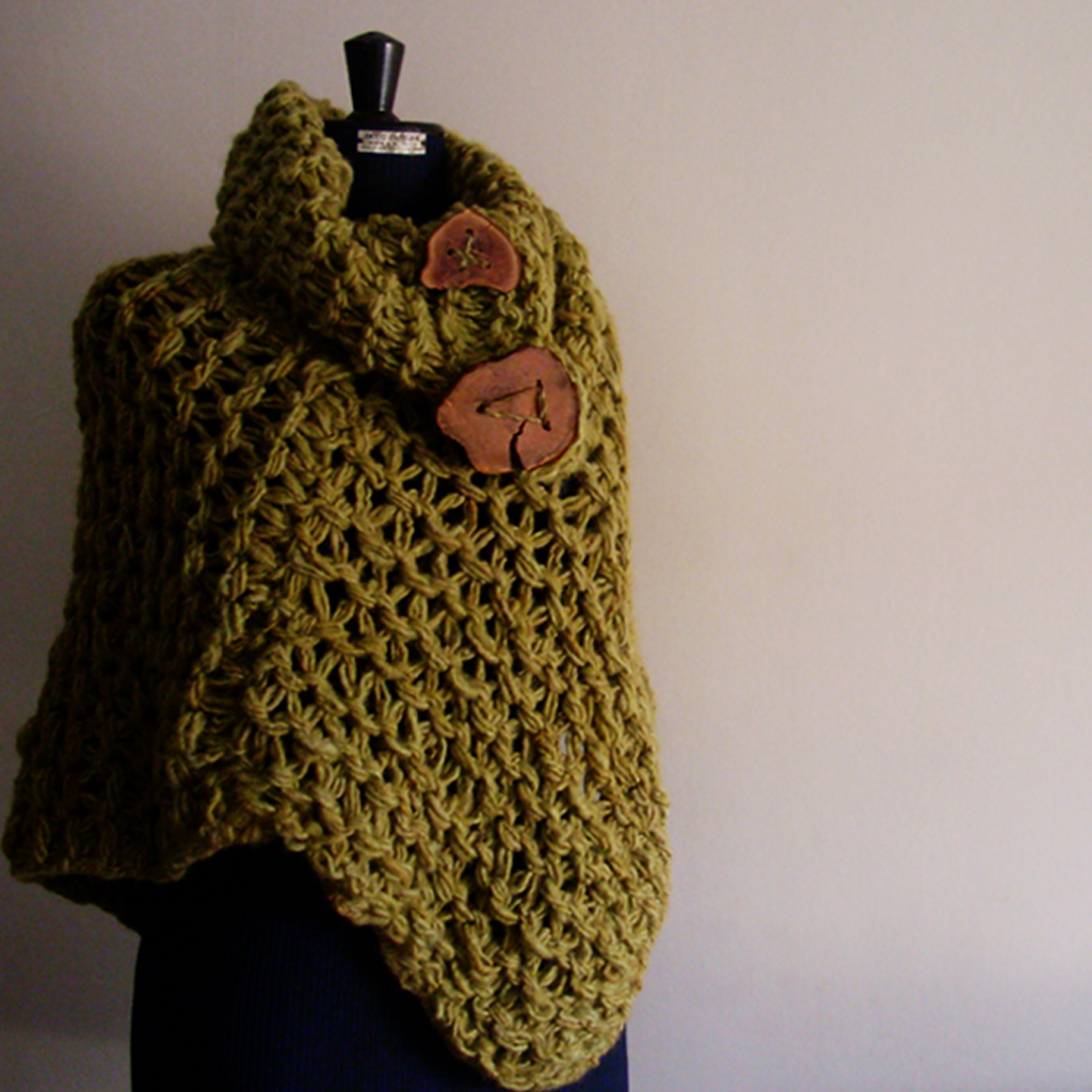 Green poncho made out of wool